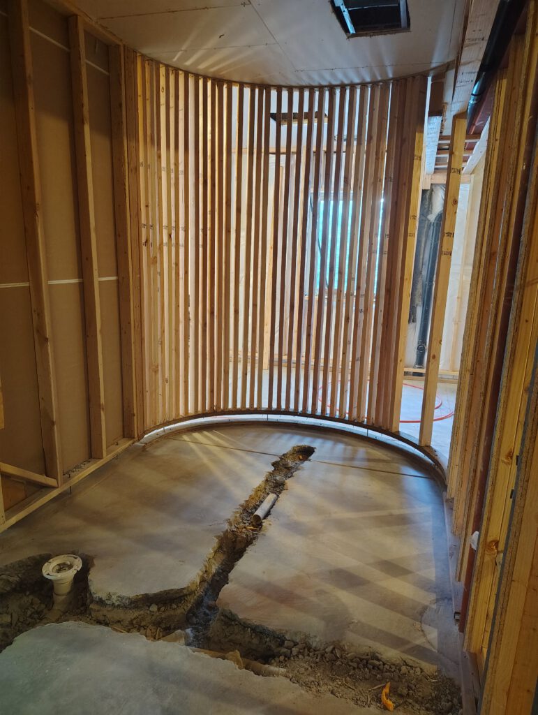 Curved basement wall framing, framed by LX